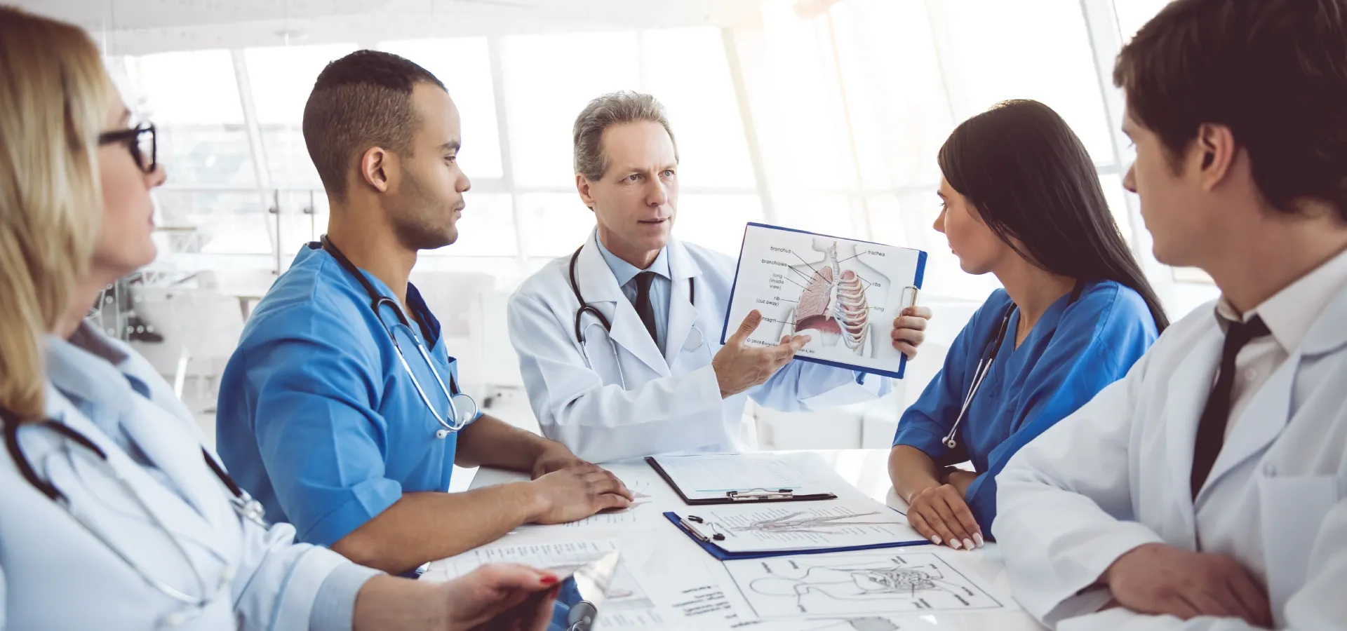 Doctors and nurses reviewing a case together